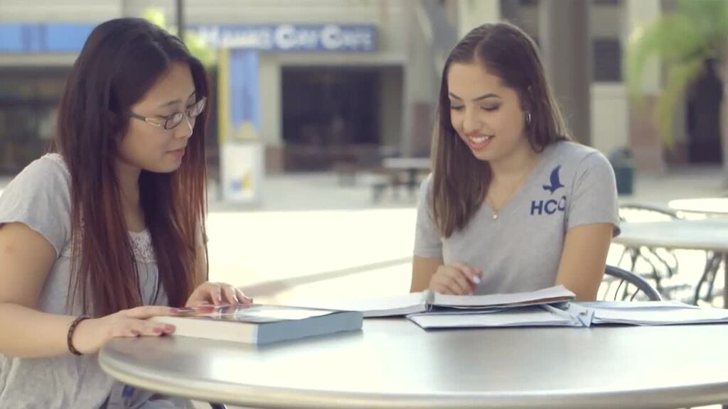 Two students siitting at a table studying