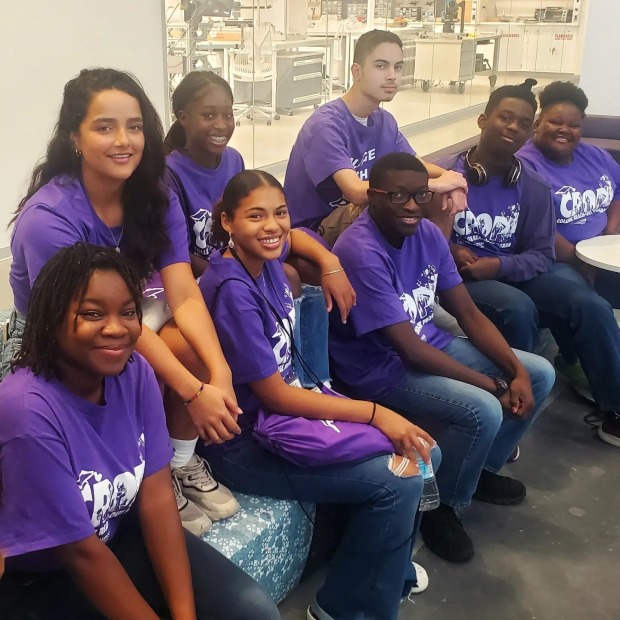 Seven students on a sofa 