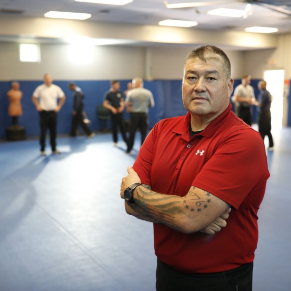 INSTRUCTOR STANDING IN FROM OF CLASS