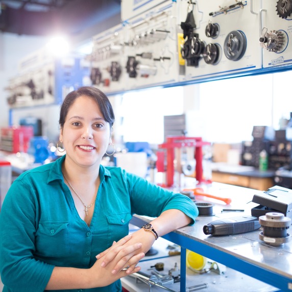 female student standing inside workforce room