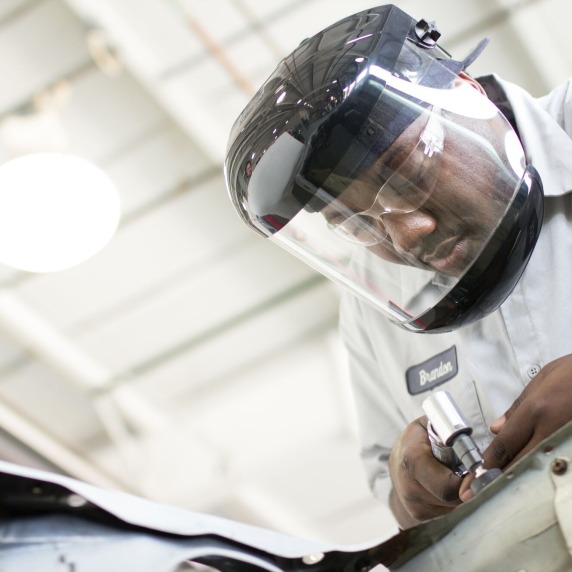 Auto Tech student working on a car