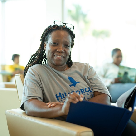 Student sitting with book.
