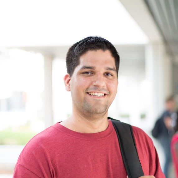 Close up of student with backpack on the way to class