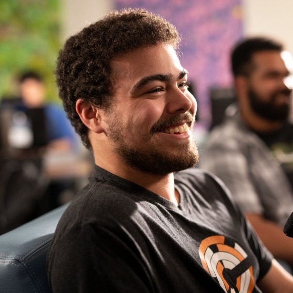Student smiling with microphone.