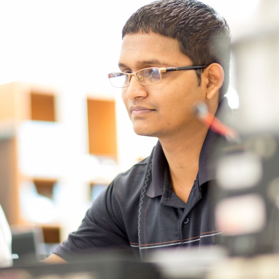 Male student working on a computer. 