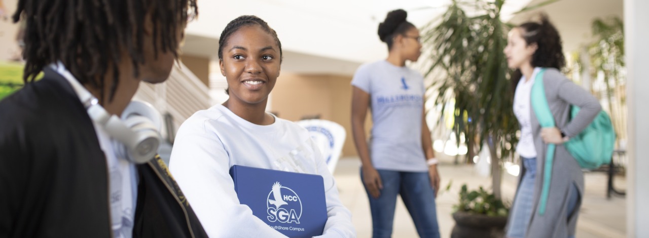 Diverse group of students chatting outside
