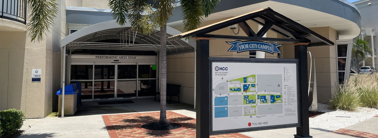 Entrance to Ybor City Campus with Performing Arts building and campus map directory.