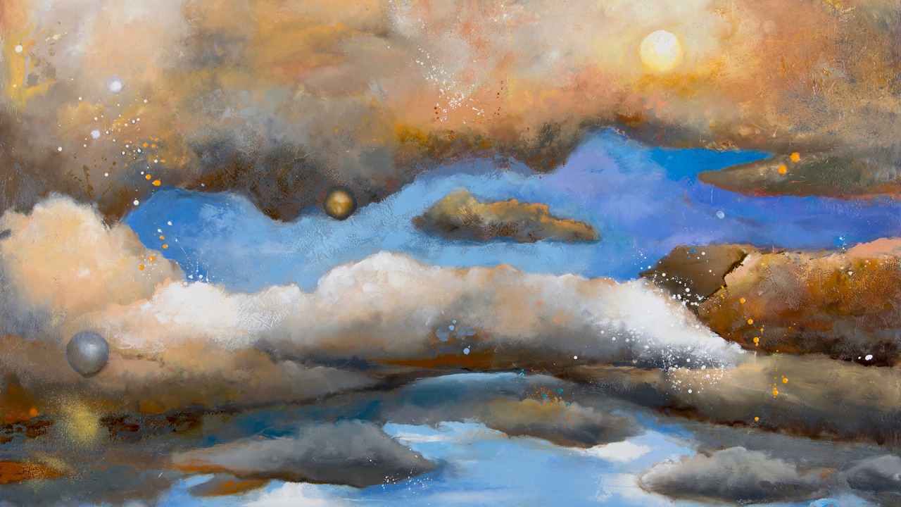 Colorful clouds painted in a blue sky with hills in the background