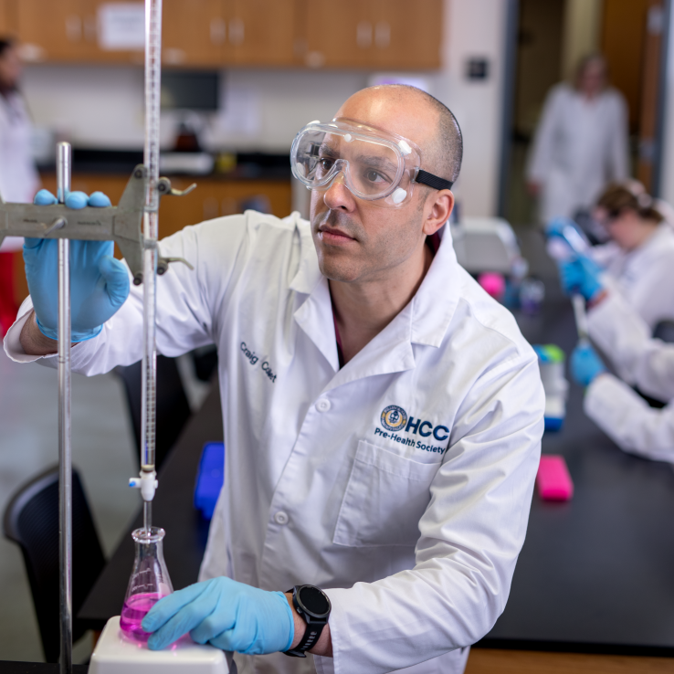 Male biotechnology student on the Brandon Campus. 