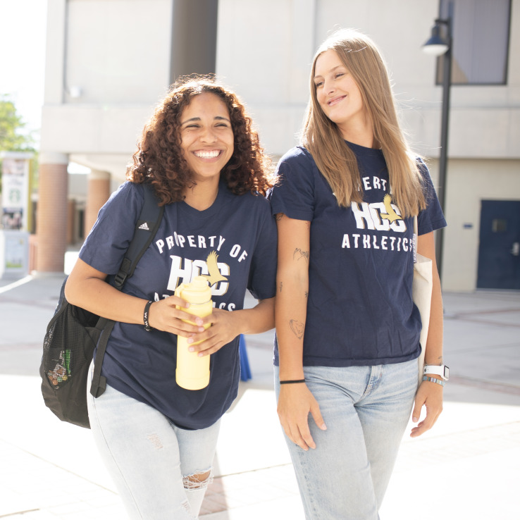 Two female student walking on the Dale Mabry Campus. 